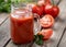 Glass of nutritious tomato juice and fresh tomatoes