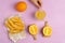 Glass of orange juice with oranges top view, amaranth pink background. Flat lay. Love for fruits, healthy food