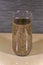 Glass with oval shaped chia seeds soaked in water