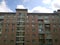 Glass and panel facade of a new multi-story residential building. Sale and rental of economy class apartments and comfortable hous