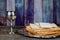 Glass of Passover wine and matzah closeup. Backlit blurred matzah texture in background.