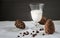 Glass Pine nuts vegan milk and cedar cones. White background. Organic vegetarian non diary nuts milk