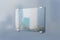 Glass plate on transparent background with blurry city on grey wall. Mockup
