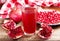 Glass of pomegranate juice with fresh fruits