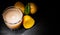 Glass of potato juice on dark wooden background