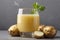 Glass of Potato Juice with Its Ingredients In Close-up On a Gray Background