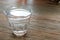 Glass of pure purified mineral drinking water on table