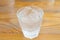 Glass of pure water and ice cube