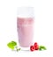 Glass of raspberry milkshake and berries