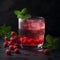 Glass of red currant syrup drink with fresh red currants and mint