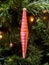 Glass red icicle-shaped pendant on a Christmas tree. The era of the USSR