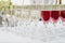 Glass of red and white wine on a table. Many glass wine in a row on white tablecloth.