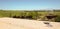 Glass of red wine on balcony overlooking Napa Valley vineyards