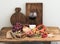 Glass of red wine, cheese and meat board, grapes,fig, strawberries, honey, bread sticks on rustic wooden table, white