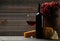 Glass of red wine, cheeses and grapes on a grey wooden background