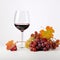 A glass of red wine next to a bunch of grapes, autumn clip art.