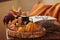 Glass of red wine with pumpkins, books and dried leaves