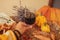 Glass of red wine with pumpkins, books and dried leaves