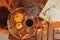 Glass of red wine with pumpkins, books and dried leaves