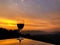 Glass of red wine during sunset over Himalayan mountain range in Nepal