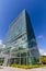 Glass reflective office buildings against blue sky