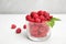 Glass with ripe aromatic raspberries