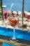 Glass of rose wine with sea and pool view