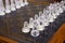 Glass and sandblasted chess pieces on glass chessb