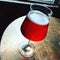 Glass of seasonal cherry beer on a bar table