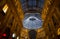 Glass skylight dome at arcade Galleria Vittorio Emanuele II illuminated with Christmas lights in Milan, Italy.