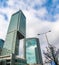 Glass skyscrapers of irregular shape. Bottom view. Abstract architectural detail of corporate building suitable as