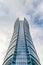 Glass skyscrapers of irregular shape. Bottom view. Abstract architectural detail of corporate building suitable as background