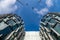 Glass skyscrapers of irregular shape. Bottom view. Abstract architectural detail of corporate building suitable as background.