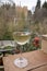 Glass of Spanish dry white wine served on outdoor terrace with view on red walls of Andalusian fortress Alhambra in Granada, Spain