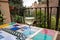 Glass of Spanish dry white wine served on outdoor terrace with view on red walls of Andalusian fortress Alhambra in Granada, Spain