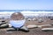 Glass sphere on stones at beach in Madeira