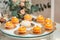 Glass stand with pastry on a wedding candy bar table