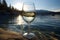 glass standing on the lake with a magnificent view of the Alpine mountains, a beautiful landscape
