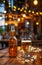 A glass of steamed beer and a glass bottle on the background of an outdoor cafe