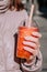 Glass of strawberry and mango bubble tea closeup in woman hand