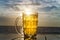 Glass tankard beer dramatic sky sunset