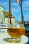 Glass with tasty apple cider in old French fisherman village, No