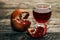 Glass of tasty pomegranate juice and pomegranate fruit