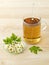 Glass of tea with fresh Feverfew flowers