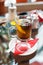 Glass of tea with lemon, cinnamon sticks, anise star and mint mint leaves