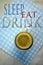 A glass of tea and text sleep eat drink on blue dot paper background