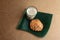 A glass of tea and vada on a wooden background