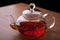 Glass teapot with black tea