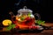 A glass teapot with fruit oolong tea in glass kettle on wooden table. Chinese traditional tea ceremony