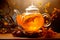 A glass teapot with yellow flowers, oolong tea in glass kettle on wooden table. Chinese traditional tea ceremony
